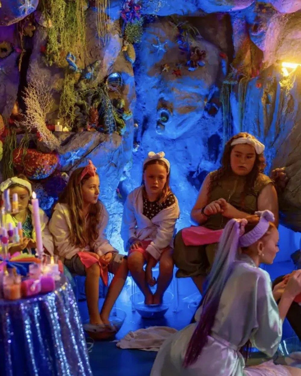 Big girls in robes and headbands relaxing at a real Sea Spa Party inside the mermaid grotto