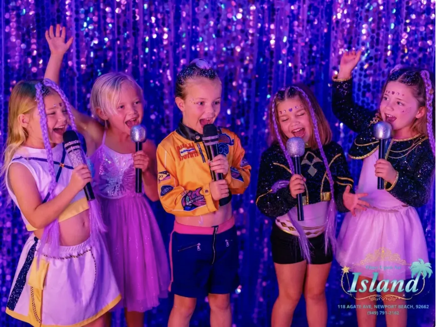 Five friends singing together against the sequin wall