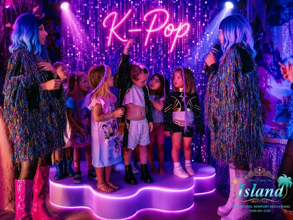 Idol hosts leading the crew on the glowing stage
