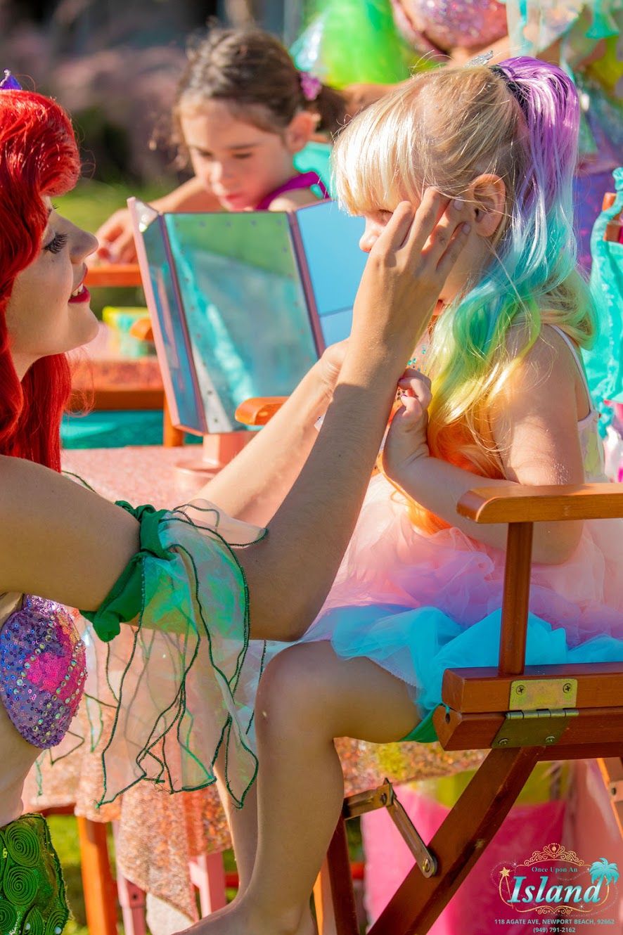 Character stylist applying a magical makeover