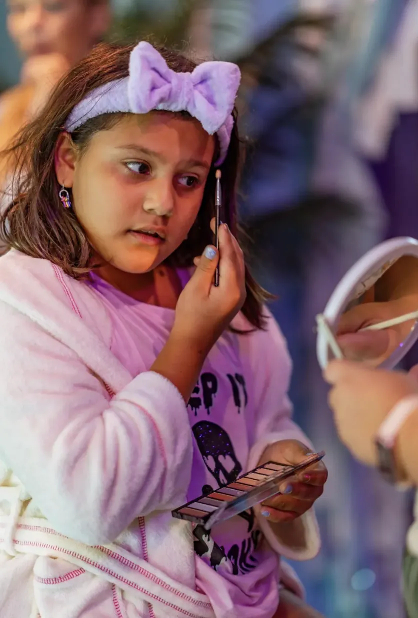 A spa guest trying her own makeup palette