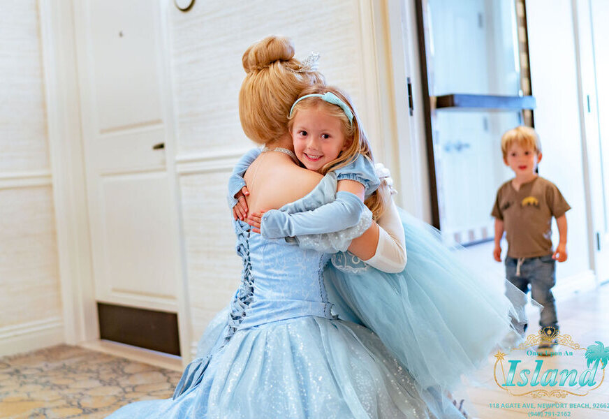 A princess hugging a little girl during a character visit