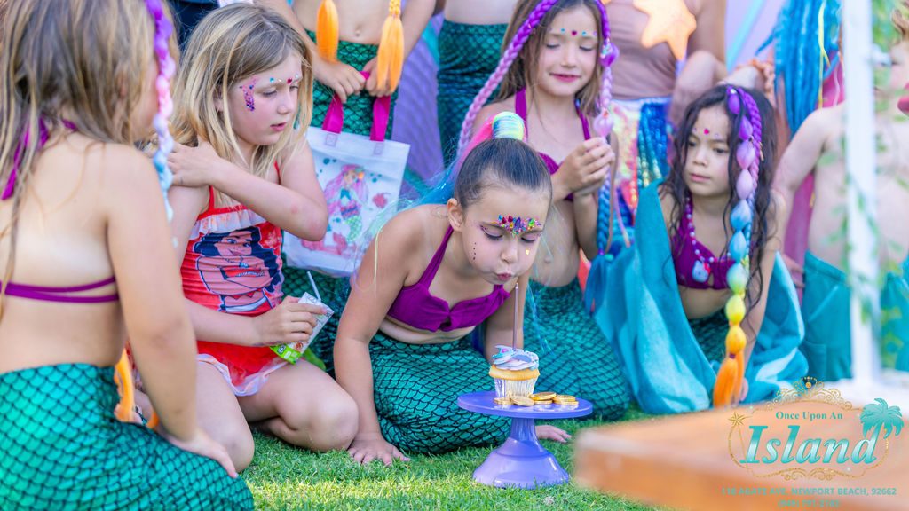 Neverland Mermaids sitting with children at a Signature Mermaid Party brought to a home in Orange County