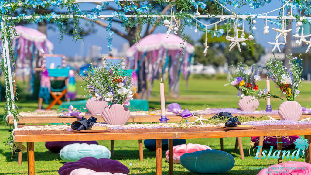 A picnic-style traveling celebration set up in a garden