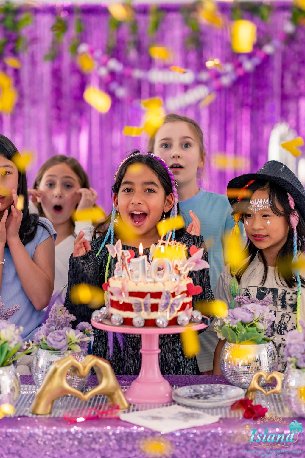 Candles and confetti at the birthday moment of a Pop Star Party