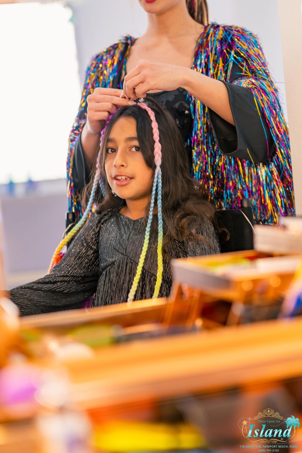 Hair tinsel and colour at the glam station at a Pop Star Party
