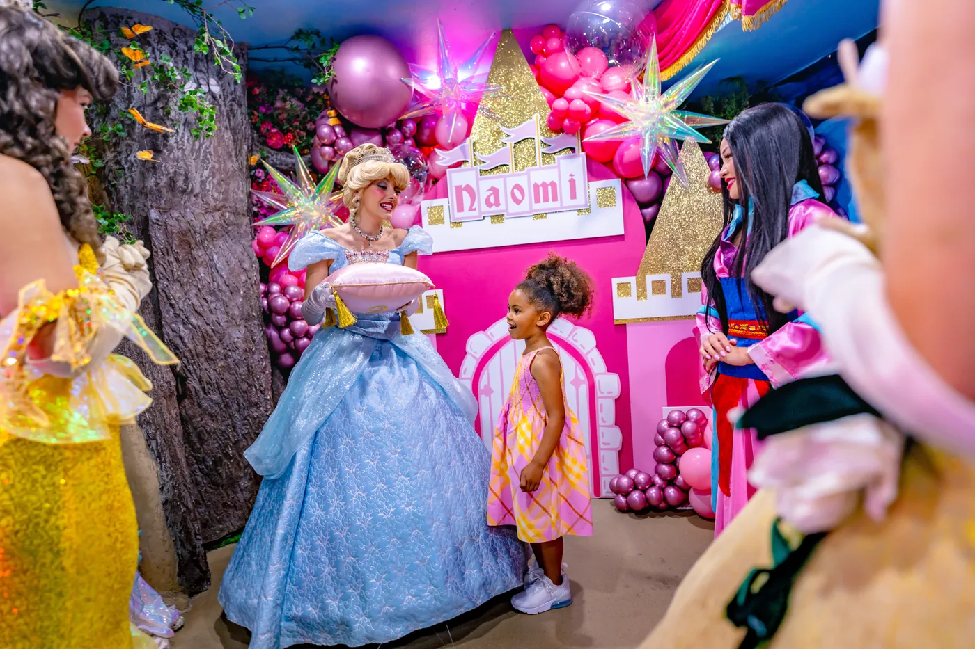 Cinderella presenting the crown on its pillow at a bespoke castle celebration