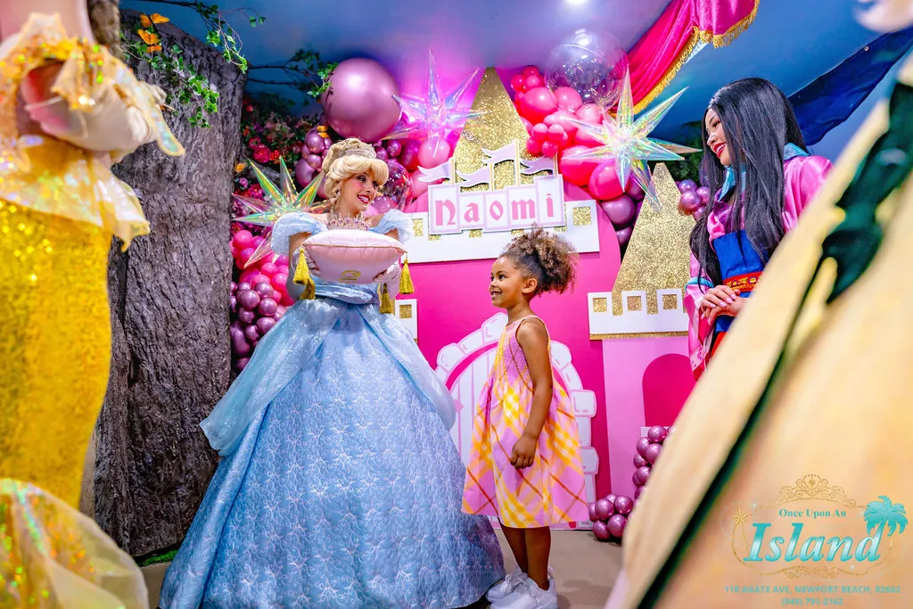 Cinderella arriving with the crown as princesses look on