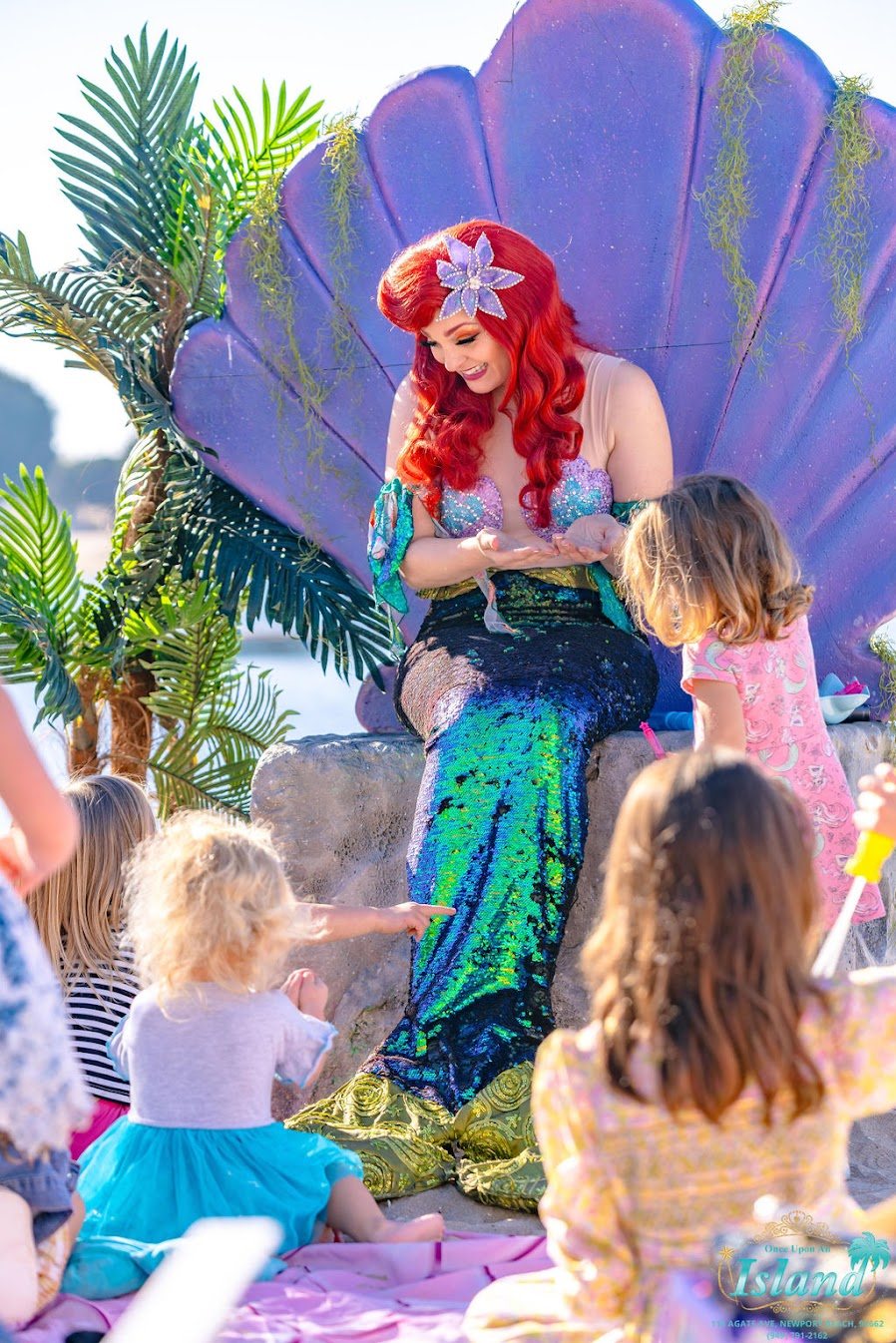 The Mermaid Princess in the clamshell throne with a guest