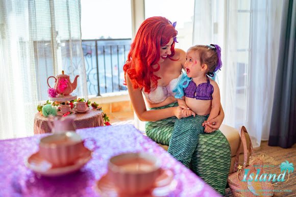 A little girl hugging the Mermaid Princess at her party