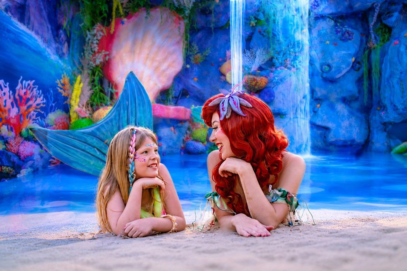 A child and princess in the magical mermaid lagoon